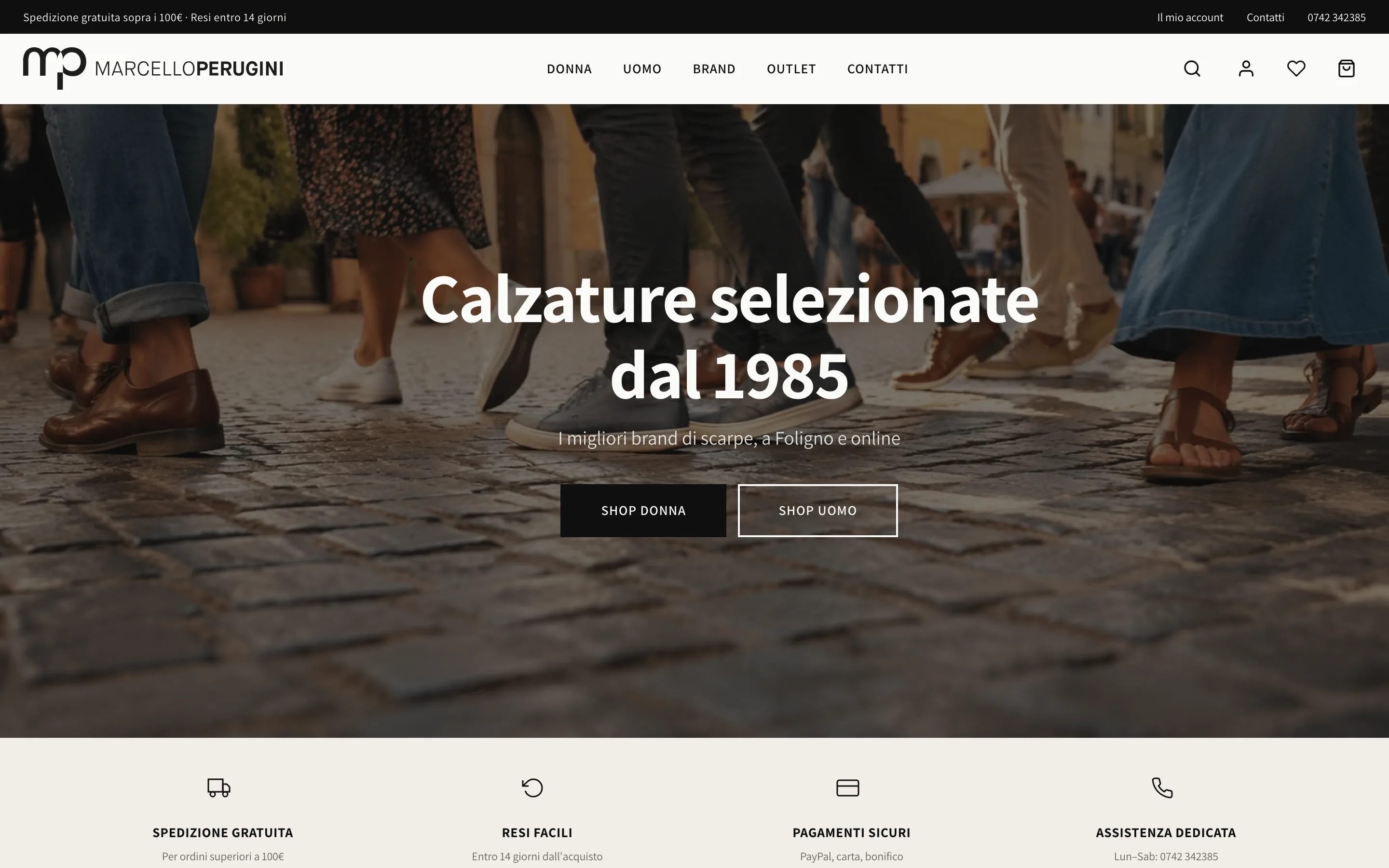 Anteprima della homepage Marcello Perugini Calzature: foto editoriale di scarpe in passeggio, claim 'Calzature selezionate dal 1985', due CTA shop donna/uomo, footer con i 4 reassurance: spedizione, resi, pagamenti, assistenza.